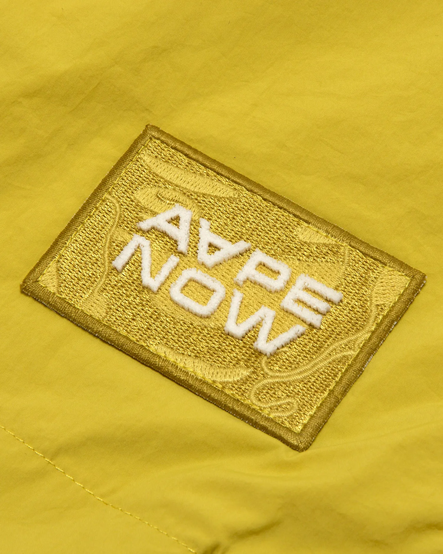 AAPENOW moonface logo windbreaker