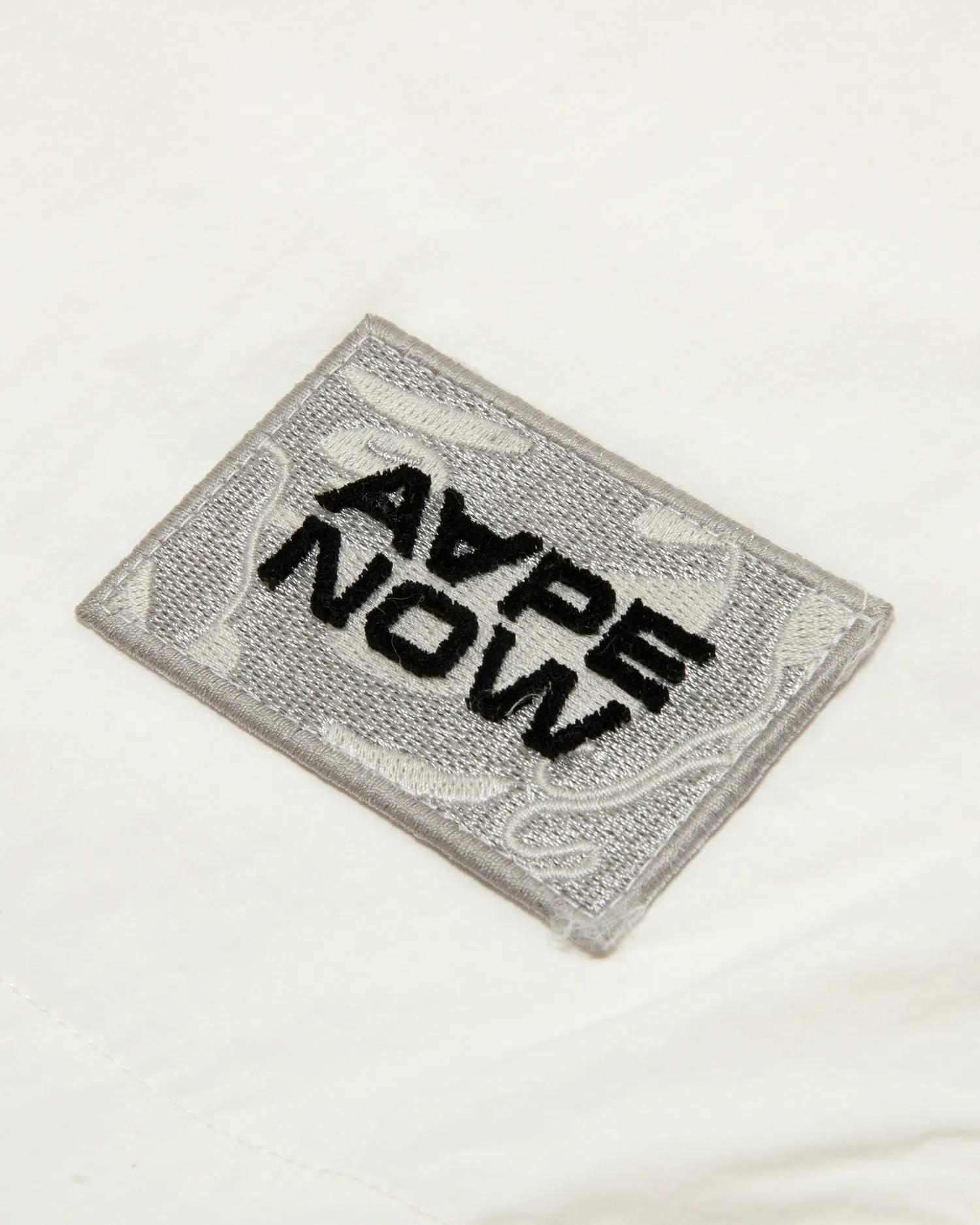 AAPENOW moonface logo windbreaker