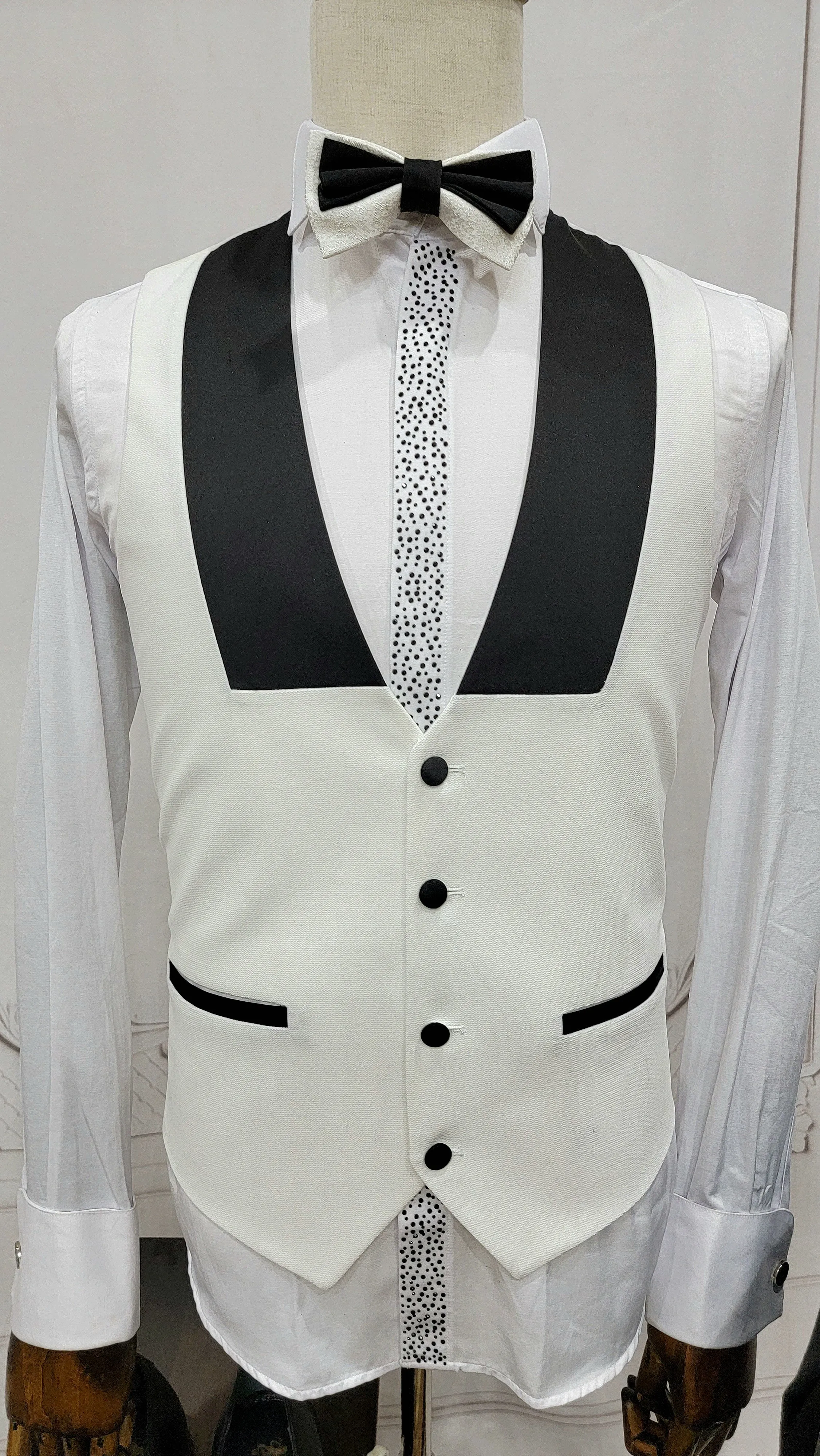 Three Pieces Tuxedo Suit with Contrasting Black Lapel, matching bow tie and Black Pants.