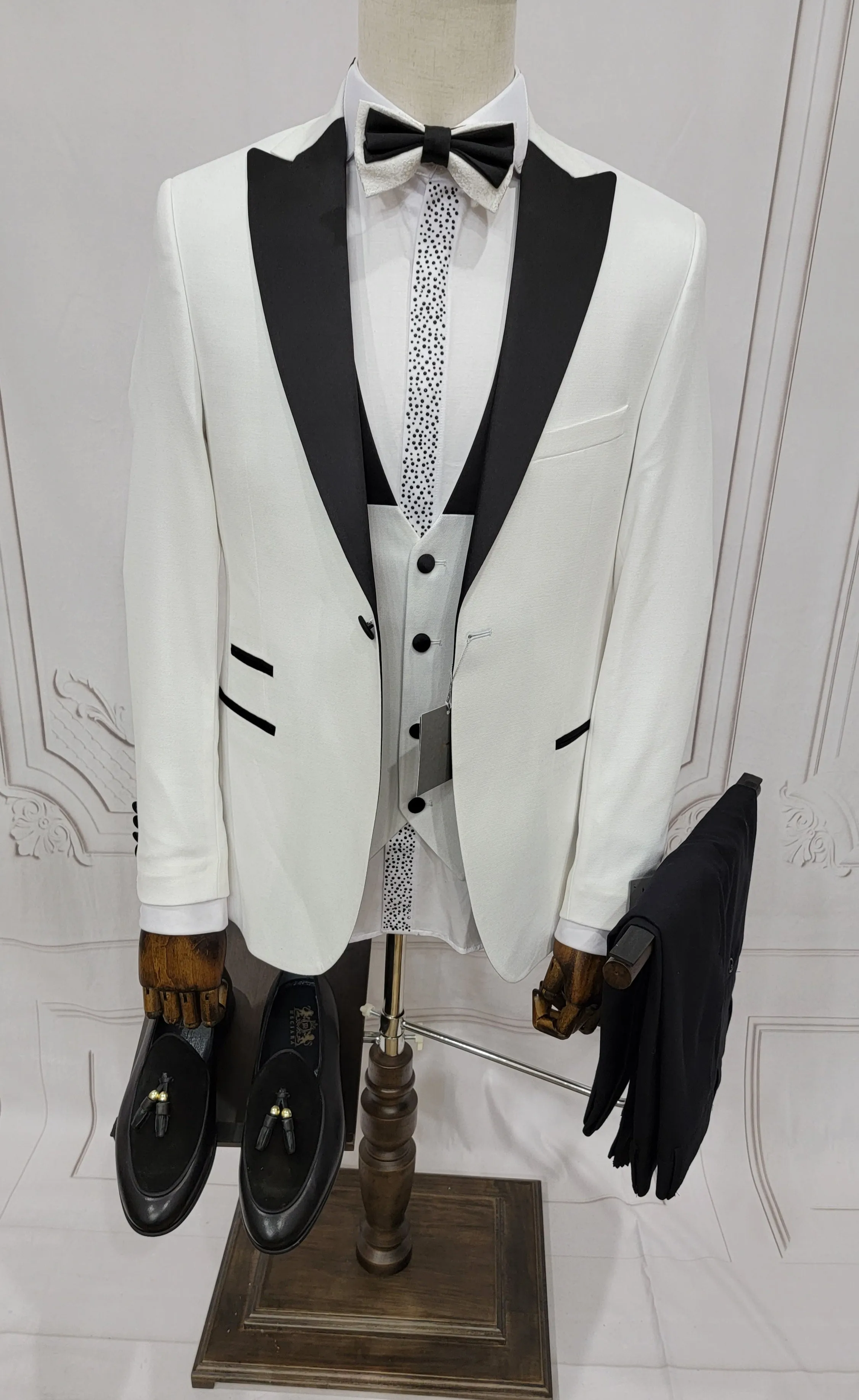 Three Pieces Tuxedo Suit with Contrasting Black Lapel, matching bow tie and Black Pants.