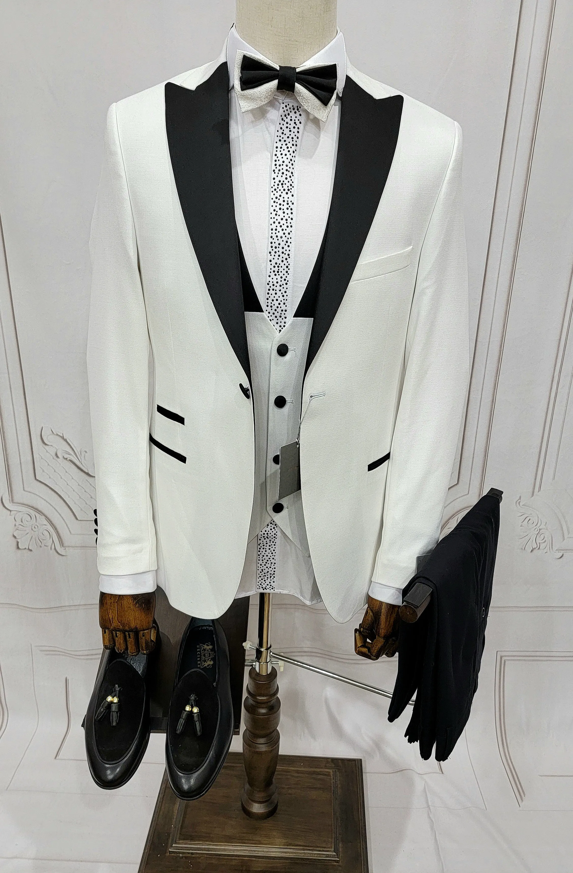 Three Pieces Tuxedo Suit with Contrasting Black Lapel, matching bow tie and Black Pants.