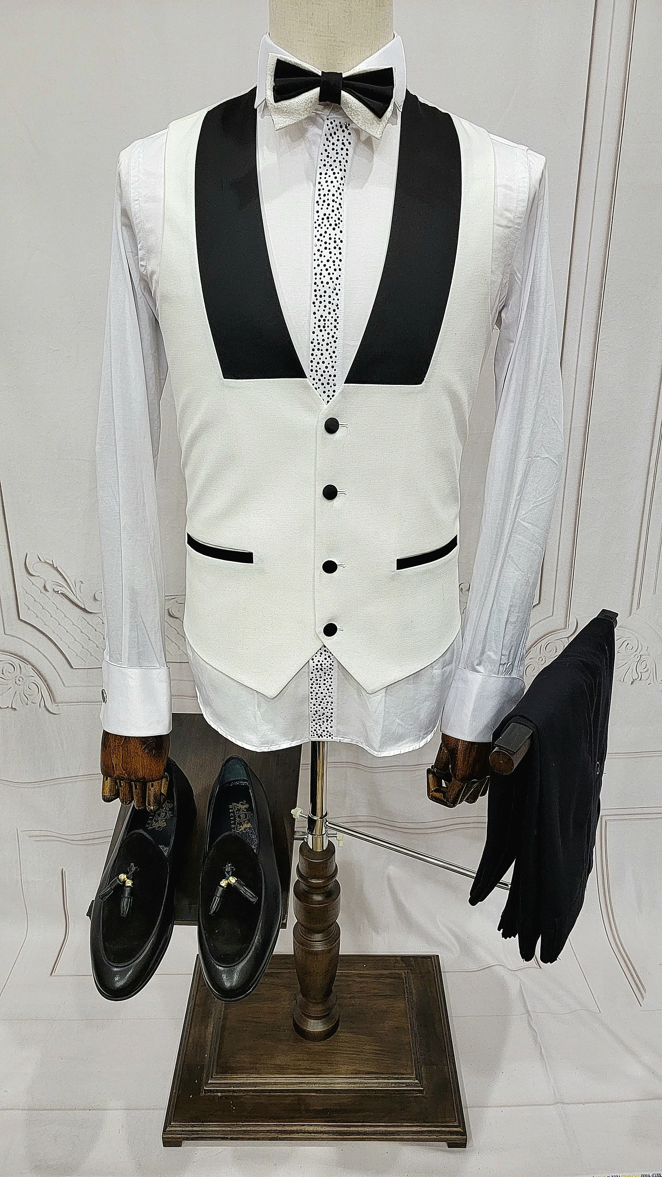 Three Pieces Tuxedo Suit with Contrasting Black Lapel, matching bow tie and Black Pants.